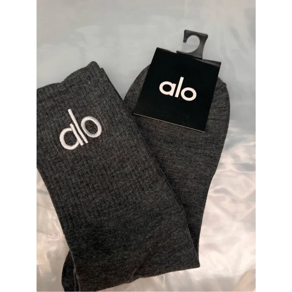 ALO Yoga unisex half crew understated socks in gray embroidered logo